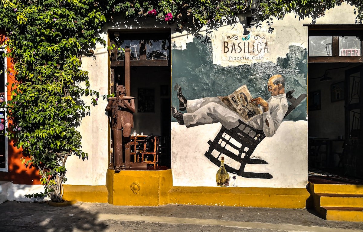 Vibrant street art murals covering building walls in Getsemani neighborhood, Cartagena