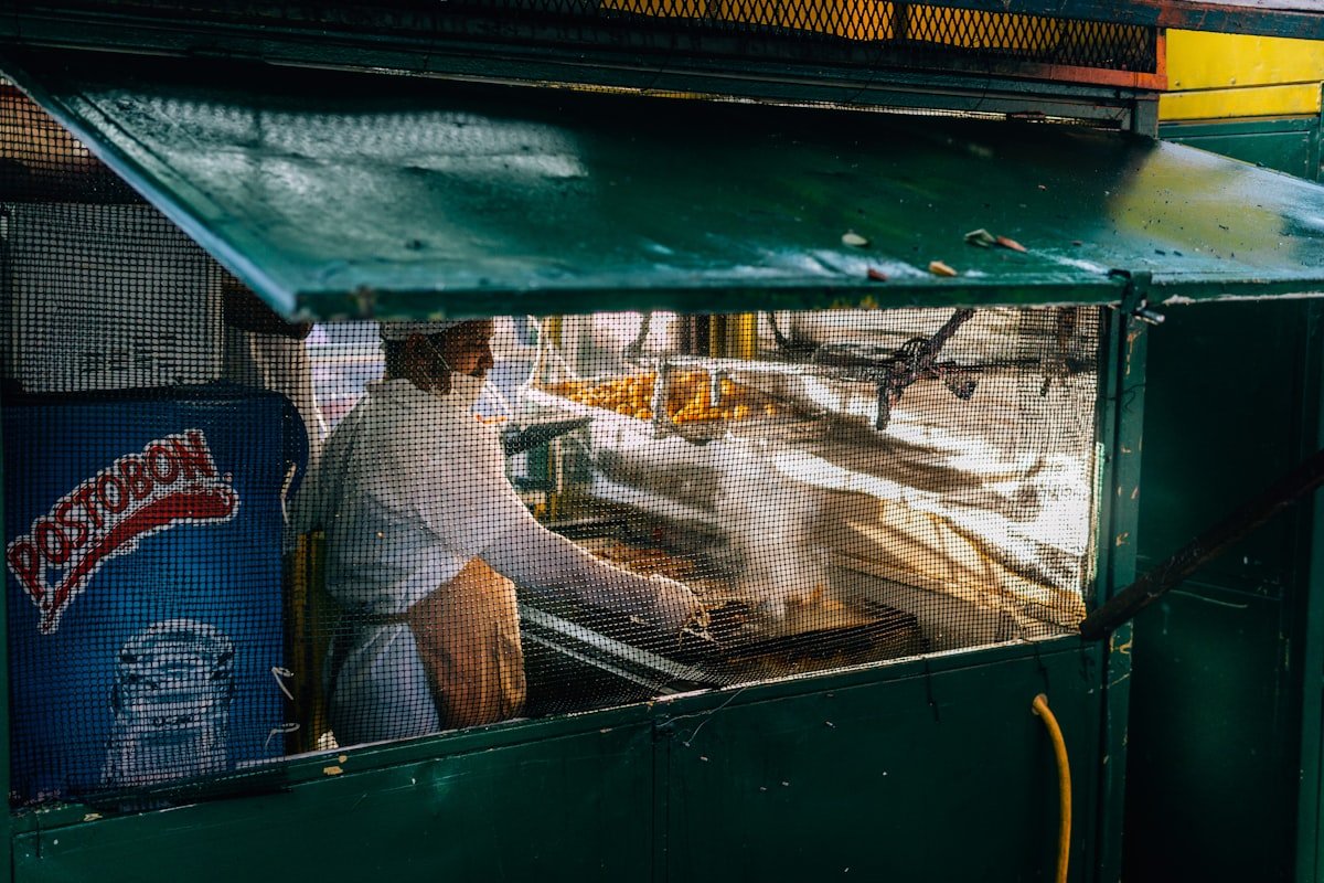 Street food vendor preparing fresh arepas de huevo in Cartagena, Colombia
