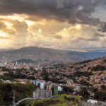 Medellin Colombia skyline at sunset — digital nomad visa guide